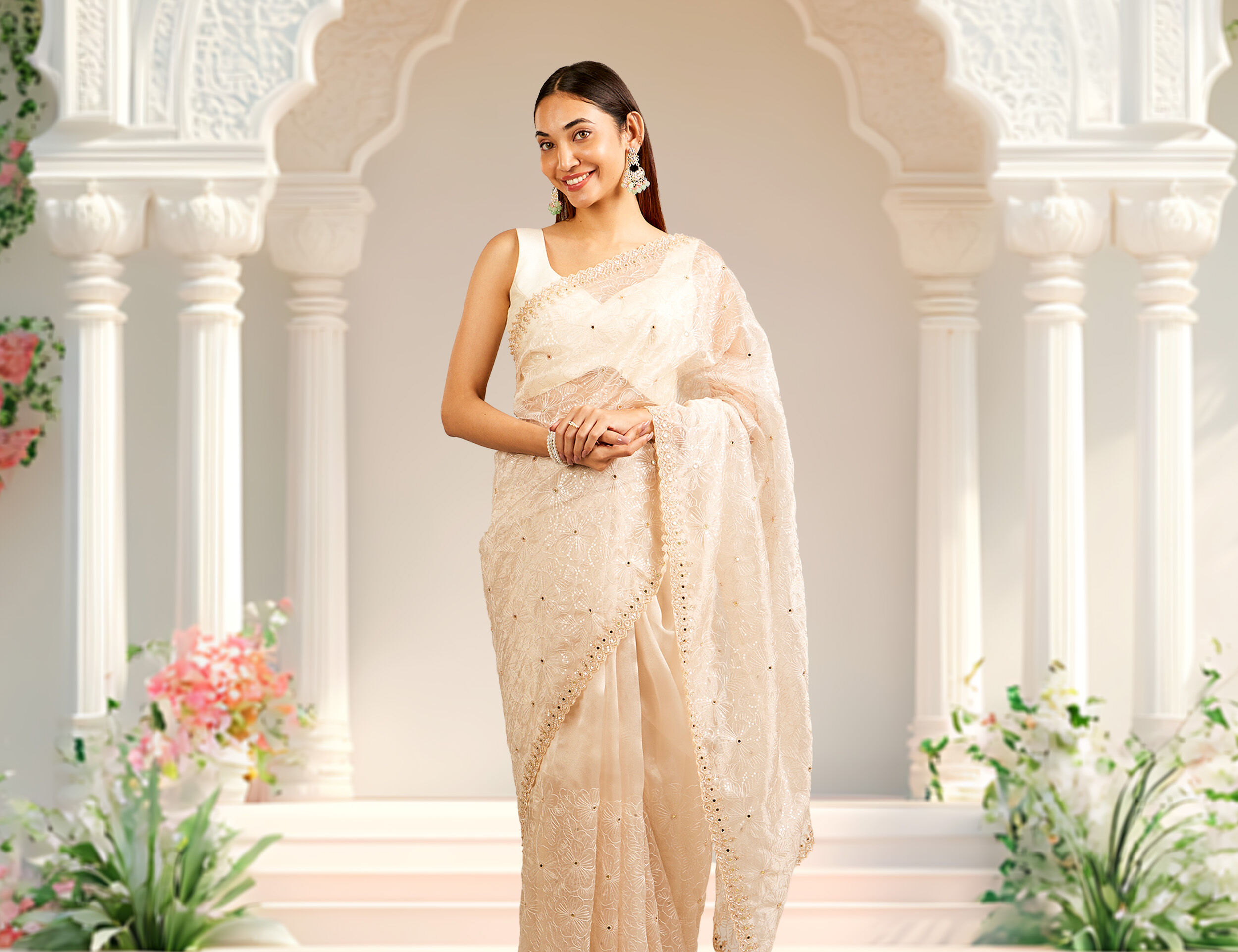 Woman flaunting her elegant cream saree